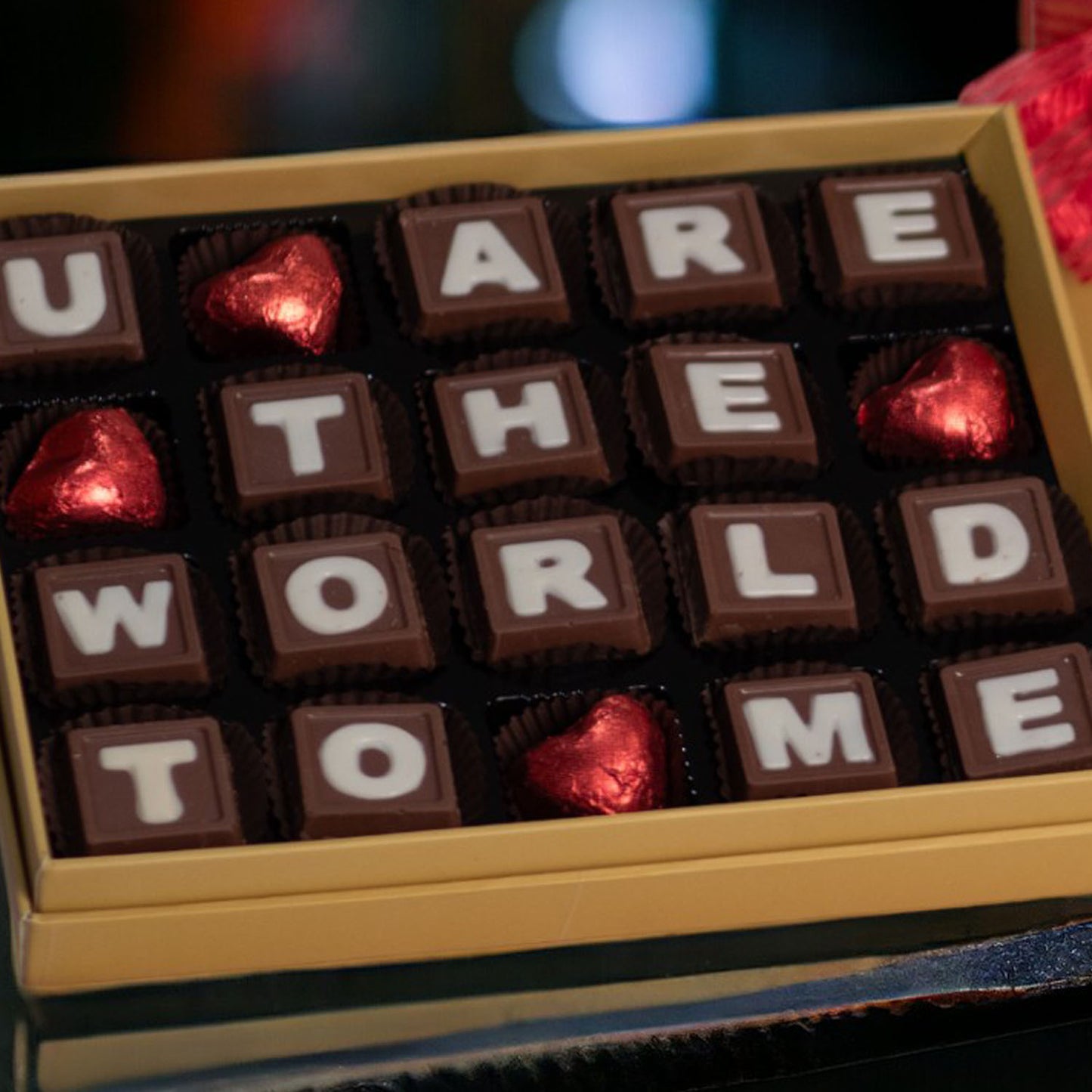 ZOROY Message Box saying U are the WORLD to meA neat and chic box containing 20 milk chocolates. The letters in the box says U mean the World to me. A perfect way to show your love and appreciation to someone who means everything.