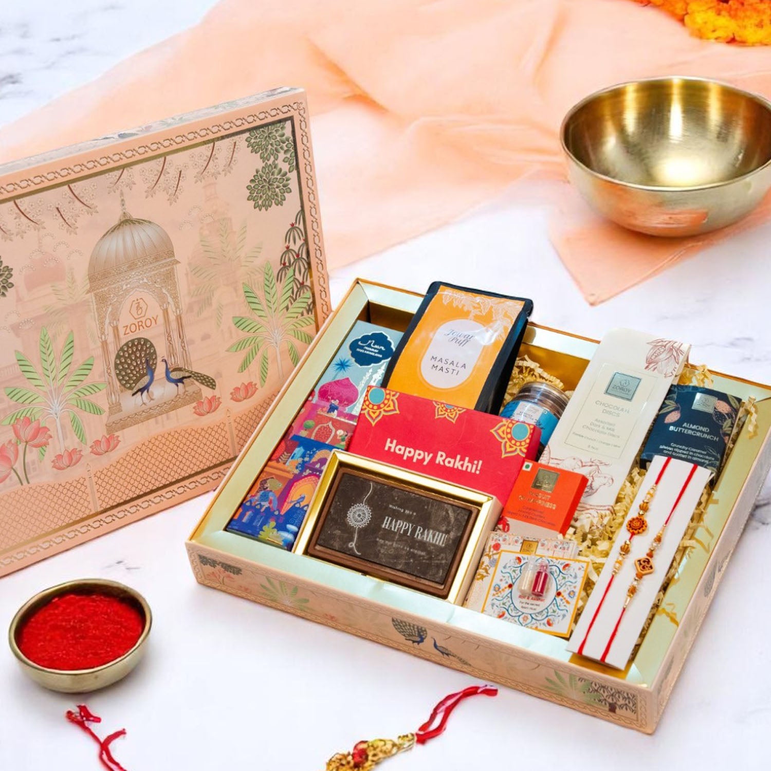 ZOROY Madhubani Rakhi Gift Hamper | Premium Noor Baklawa, Snacks, Almonds, Berries, Chocolates, Buttercrunch, 2 Rakhis, Printed Chocolate Box, Akshat Kumkum & Rakhi Card | Raksha Bandhan Gift