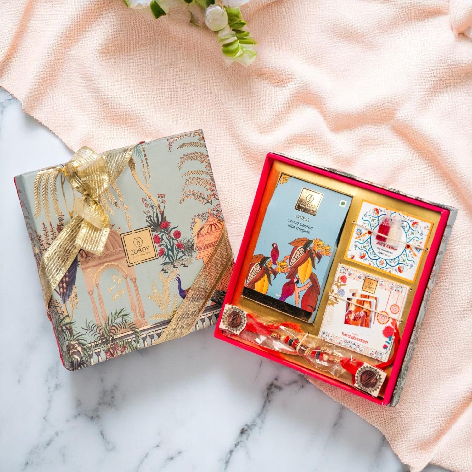 ZOROY Rakhi Gift Kit | Compact Raksha Bandhan Hamper with Quest Choco Rice Crisps, 2 Rakhis, Akshat Kumkum, Rakhi Card | Essentials-Only Rakhi Gift Box for Brother, Bhabhi, Kids & Family