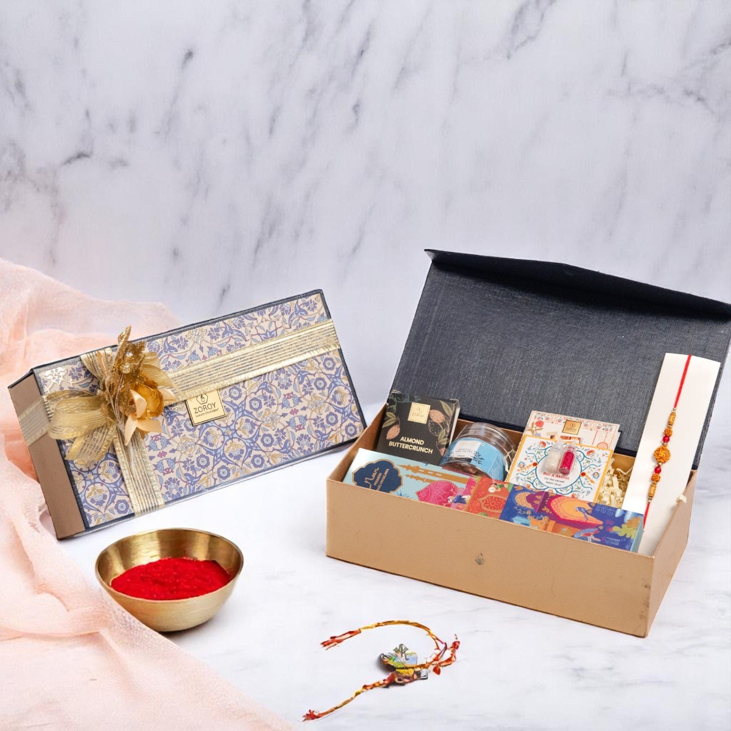 ZOROY Neel Rakhi Hamper with 4 Premium Noor Baklava, 50g Salted Almonds, Buttercrunch Snacks, Designer Rakhi, Akshat Kumkum Pack & Rakhi Card – Traditional Raksha Bandhan Gift Set