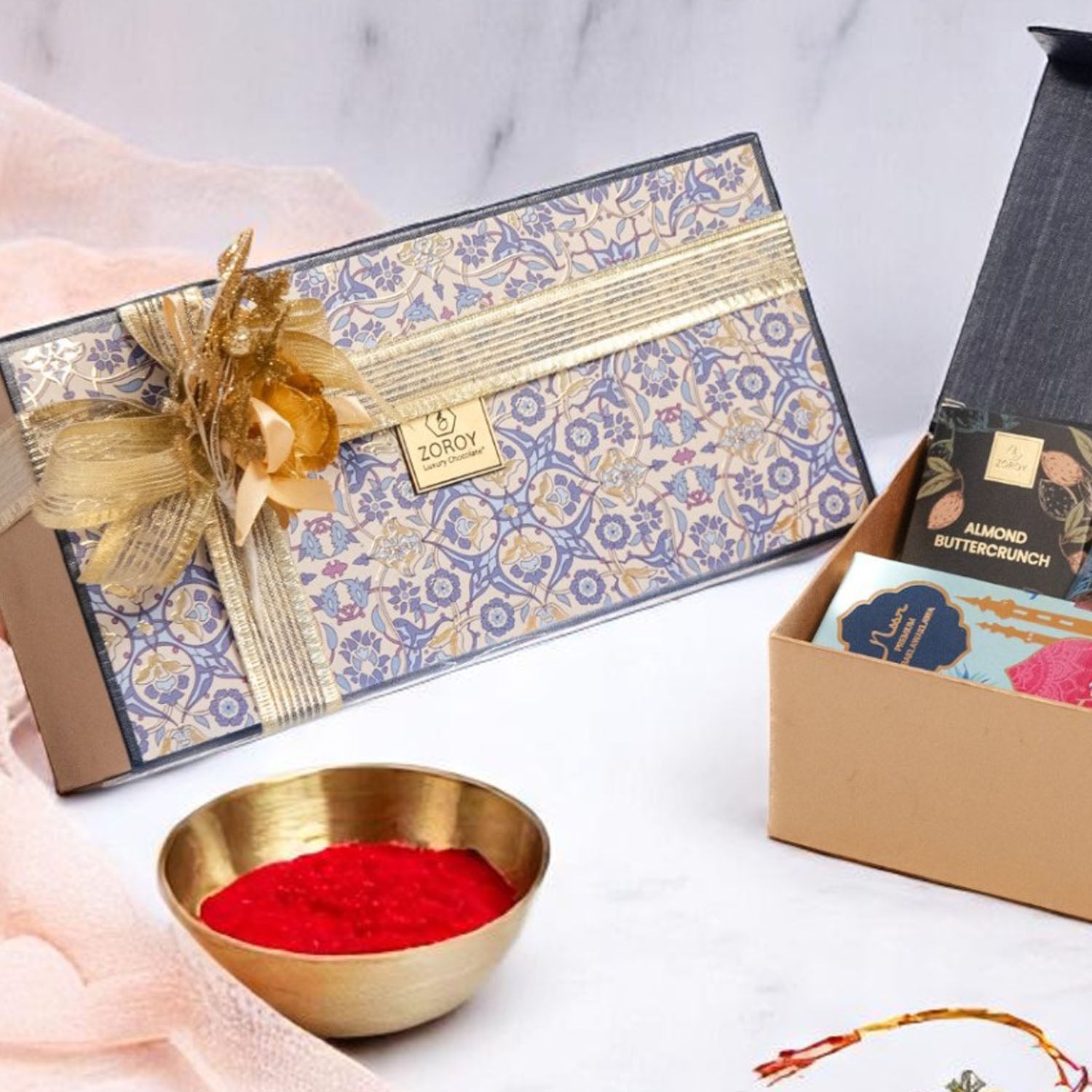 ZOROY Neel Rakhi Hamper with 4 Premium Noor Baklava, 50g Salted Almonds, Buttercrunch Snacks, Designer Rakhi, Akshat Kumkum Pack & Rakhi Card – Traditional Raksha Bandhan Gift Set