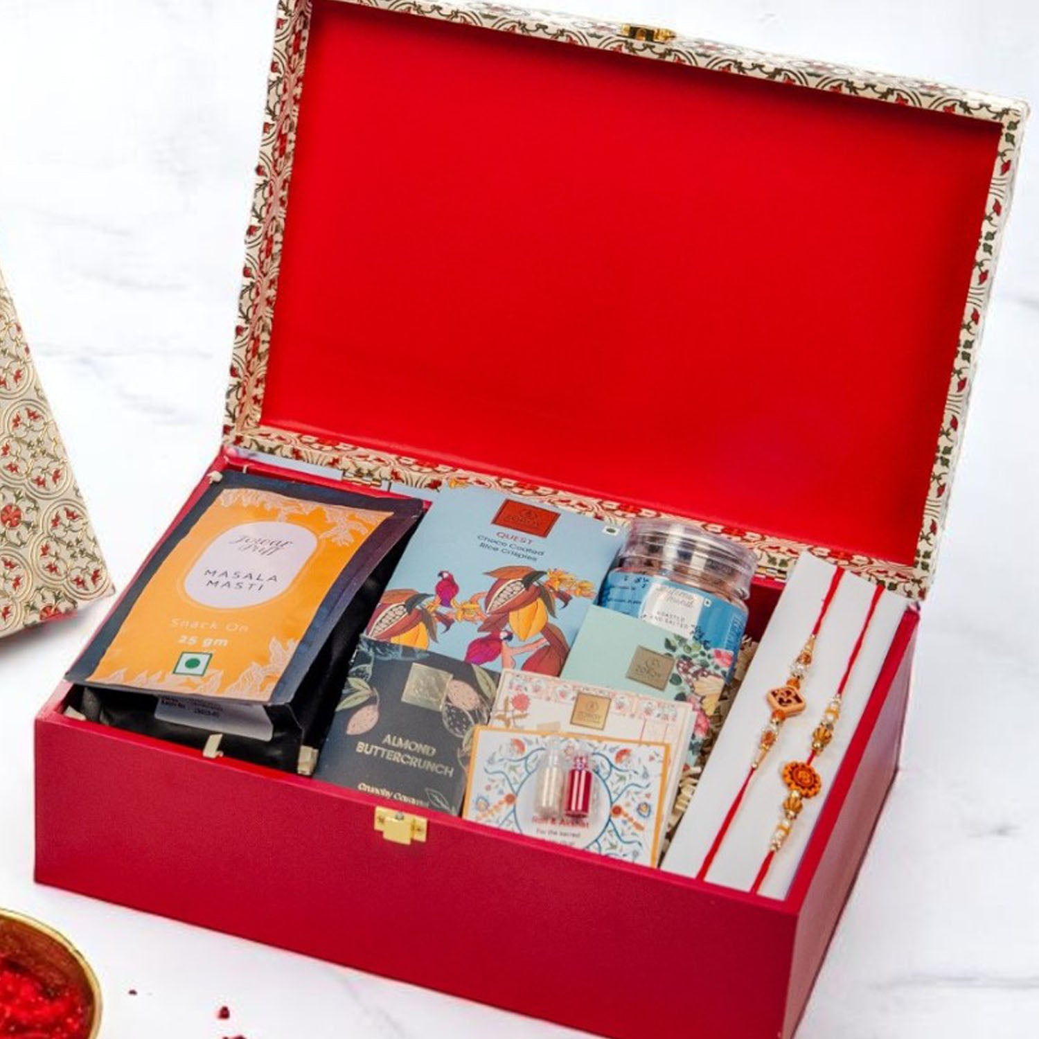 ZOROY Opulent Wooden Rakhi Gift Hamper | Traditional Design with Assorted Snacks & Chocolates | Includes 2 Rakhis, Akshat Kumkum & Rakhi Card | Premium Raksha Bandhan Gift Box for Brother & Sister