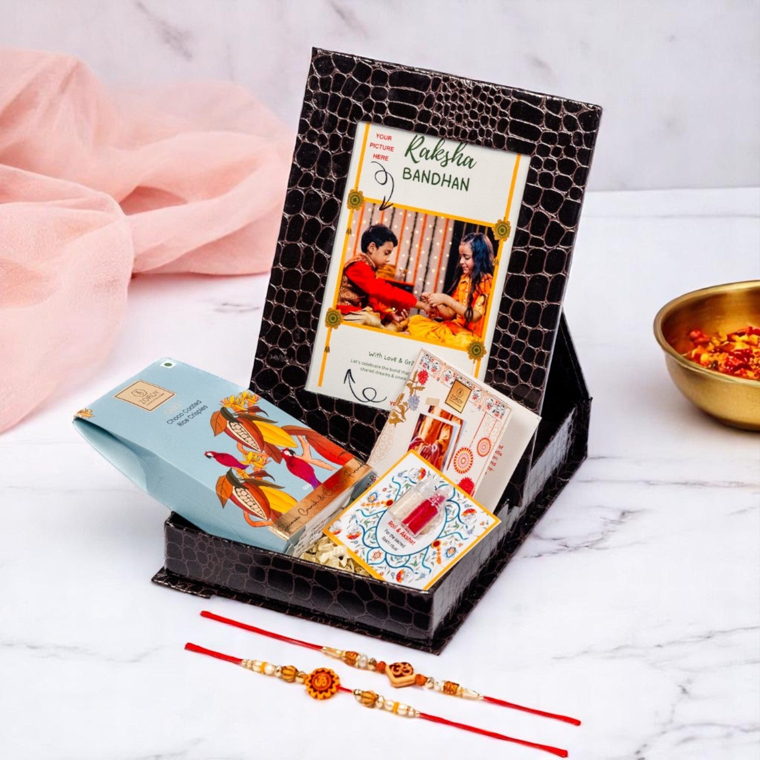 ZOROY Personalized Rakhi Photo Box Hamper – Custom Upload Picture Keepsake Rakhi Gift Box with Choco Coated Rice Crisps, 2 Rakhis, Akshat Kumkum, Rakhi Card | Raksha Bandhan Gifts for Brother