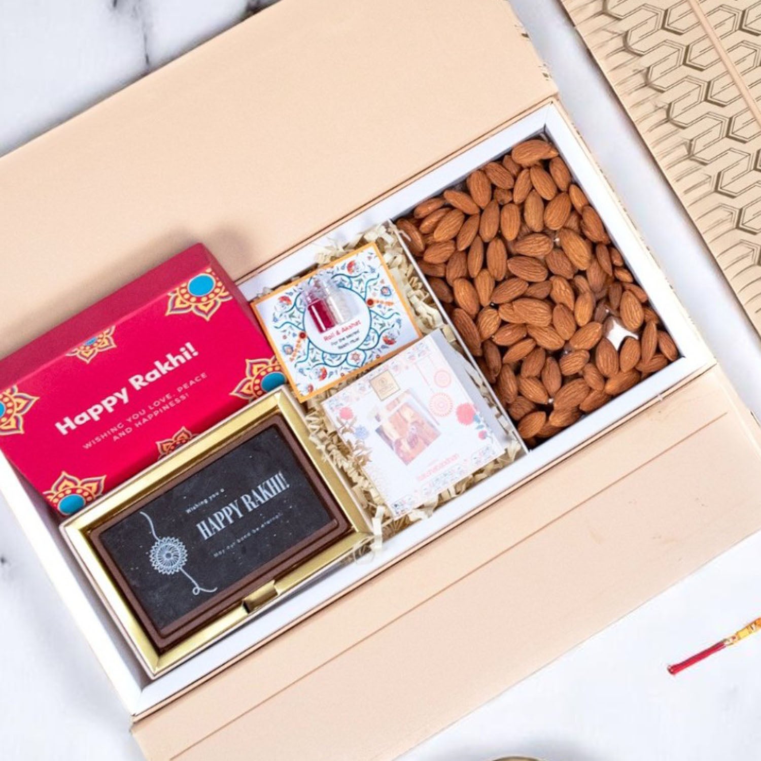 ZOROY Rakhi Wing Gift Hamper with Happy Rakhi Chocolate Box, Designer Rakhi, Almonds 100g, Akshat Kumkum, Rakhi Card | Rakhi Gift for Brother | Raksha Bandhan Celebration Essentials Box