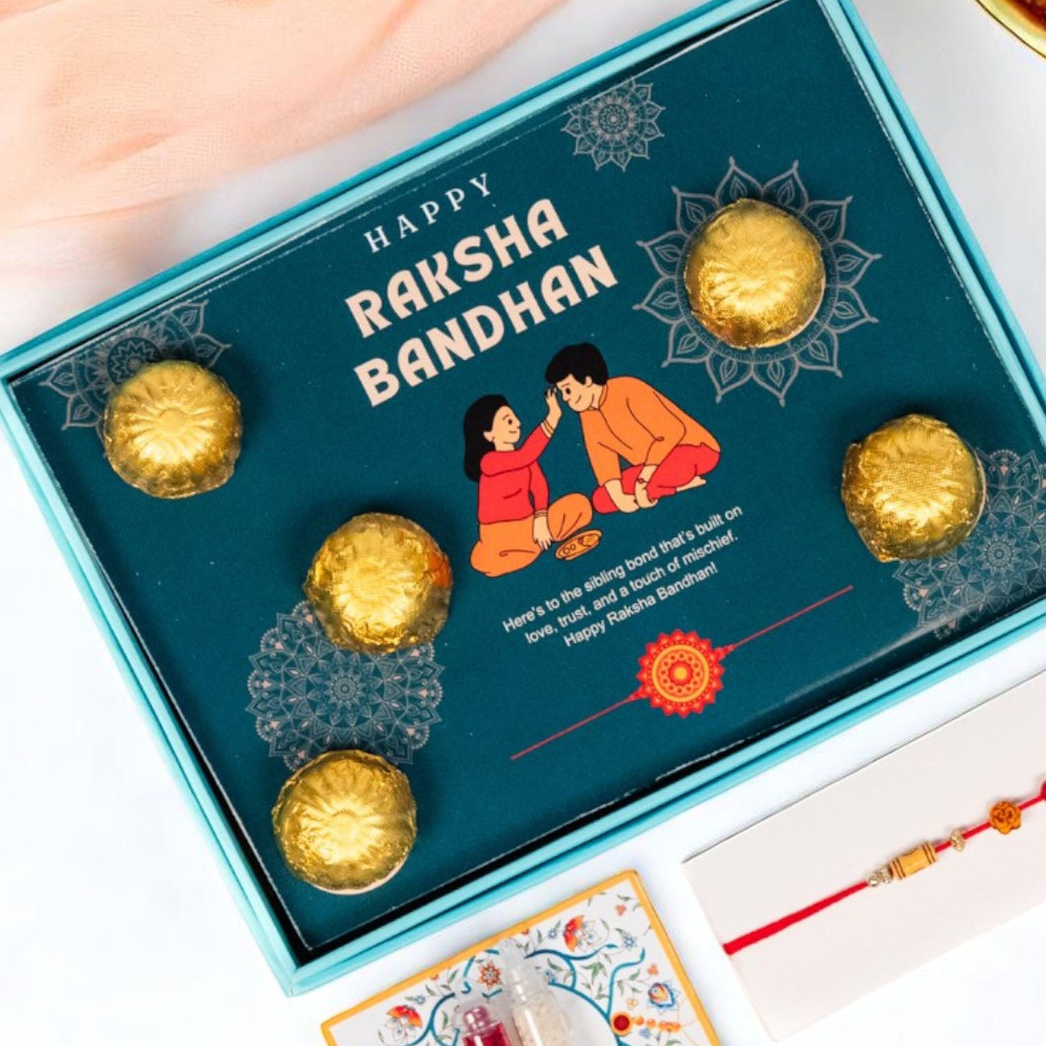 ZOROY Rakhi Gift Box with 5 Chocolates, 1 Designer Rakhi, Akshat Kumkum Pack | Raksha Bandhan Gift Hamper for Brother, Sister, Kids | Ready-to-Gift Rakhi Set