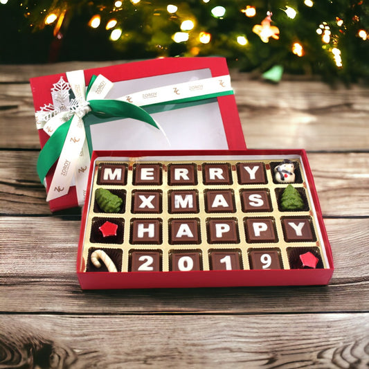 Seasons most popular chocolate Box with the message "Merry X mas and Happy 2018" written on milk chocolate