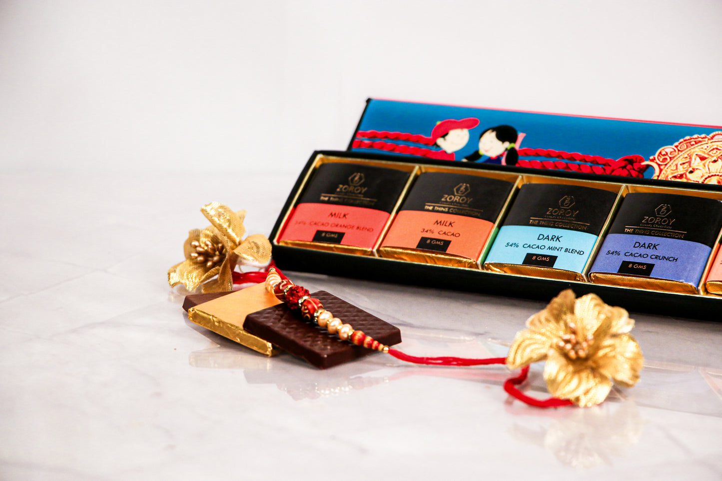 ZOROY LUXURY CHOCOLATE Rakhi Chocolate Gift for Brother | Rakhi Gift for Brother Bhabhi | Rakhshabandhan gift for sister| Rakhi gift chocolate pack | Signature Belgian style thins | set of 8 | 112 gms