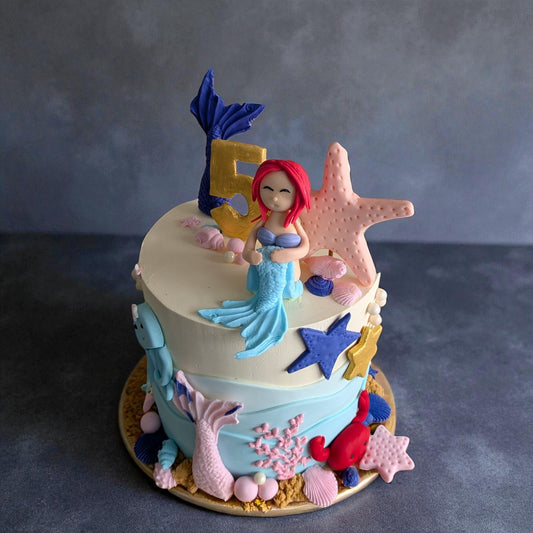 Mermaid in ocean theme cake