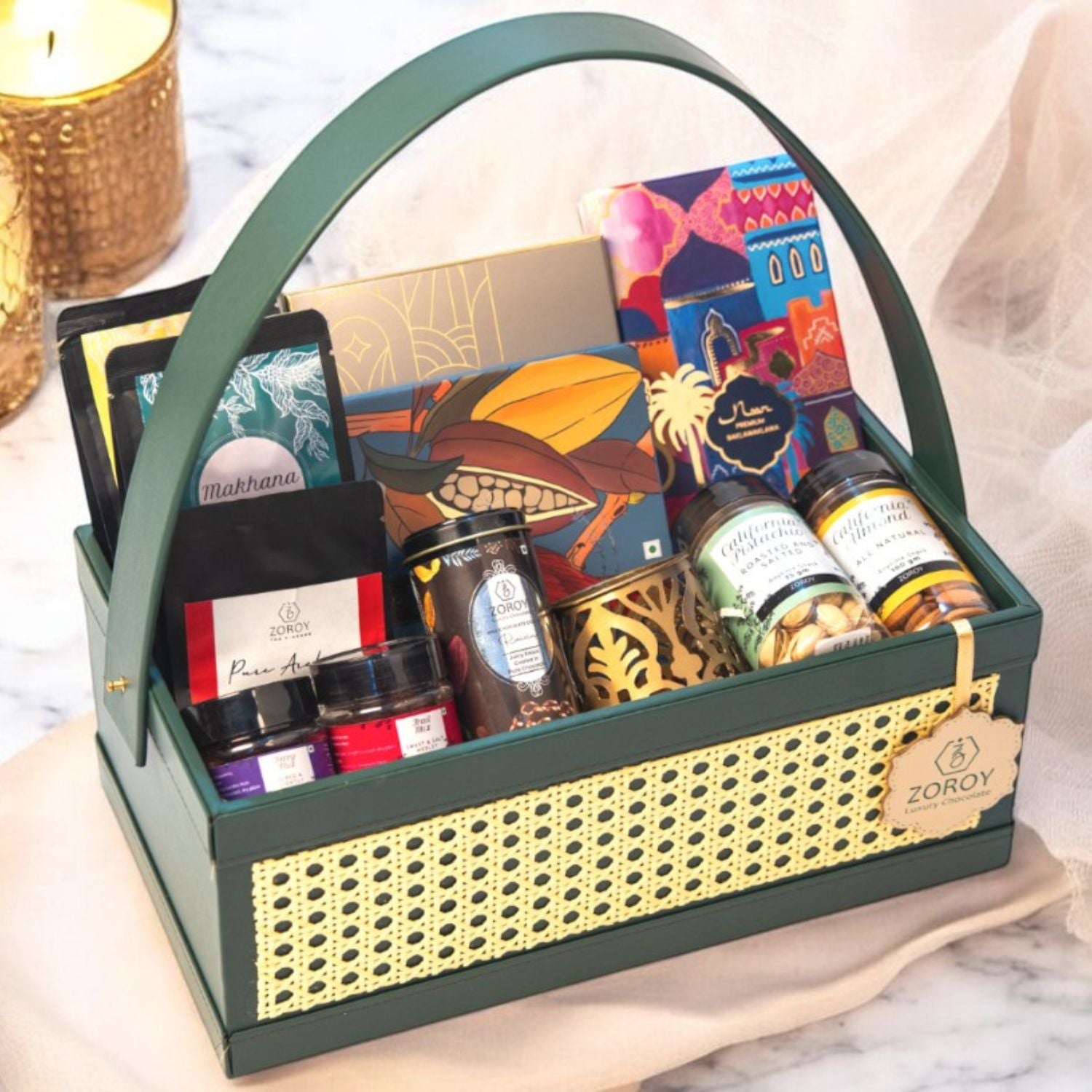 ZOROY green Luxe Rattan Hamper with Chocolates, Dry Fruits, Turkish Baklawa, Metal festive votive, arabica coffee,, mixed berries, snack packs. Perfect for everyday and festive gifting