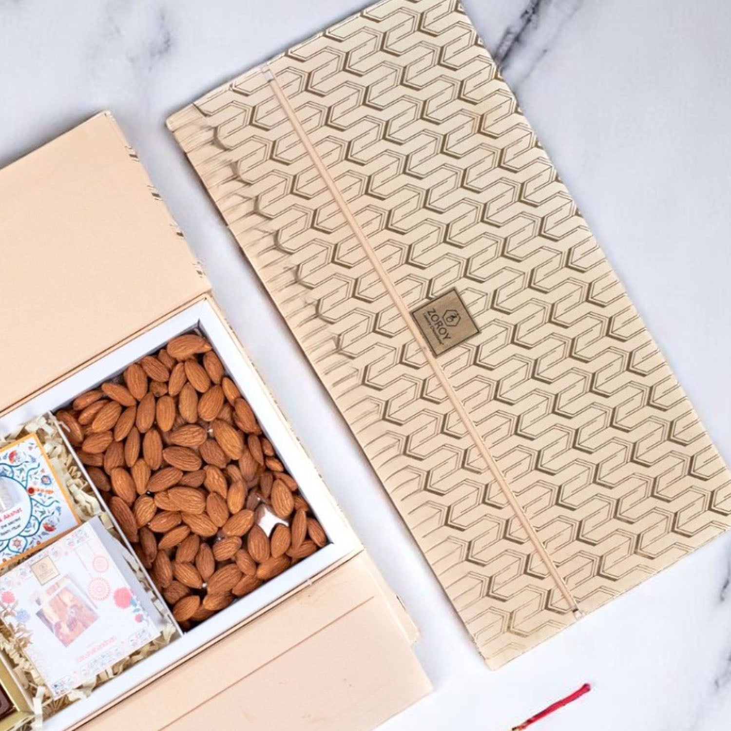 ZOROY Rakhi Wing Gift Hamper with Happy Rakhi Chocolate Box, Designer Rakhi, Almonds 100g, Akshat Kumkum, Rakhi Card | Rakhi Gift for Brother | Raksha Bandhan Celebration Essentials Box