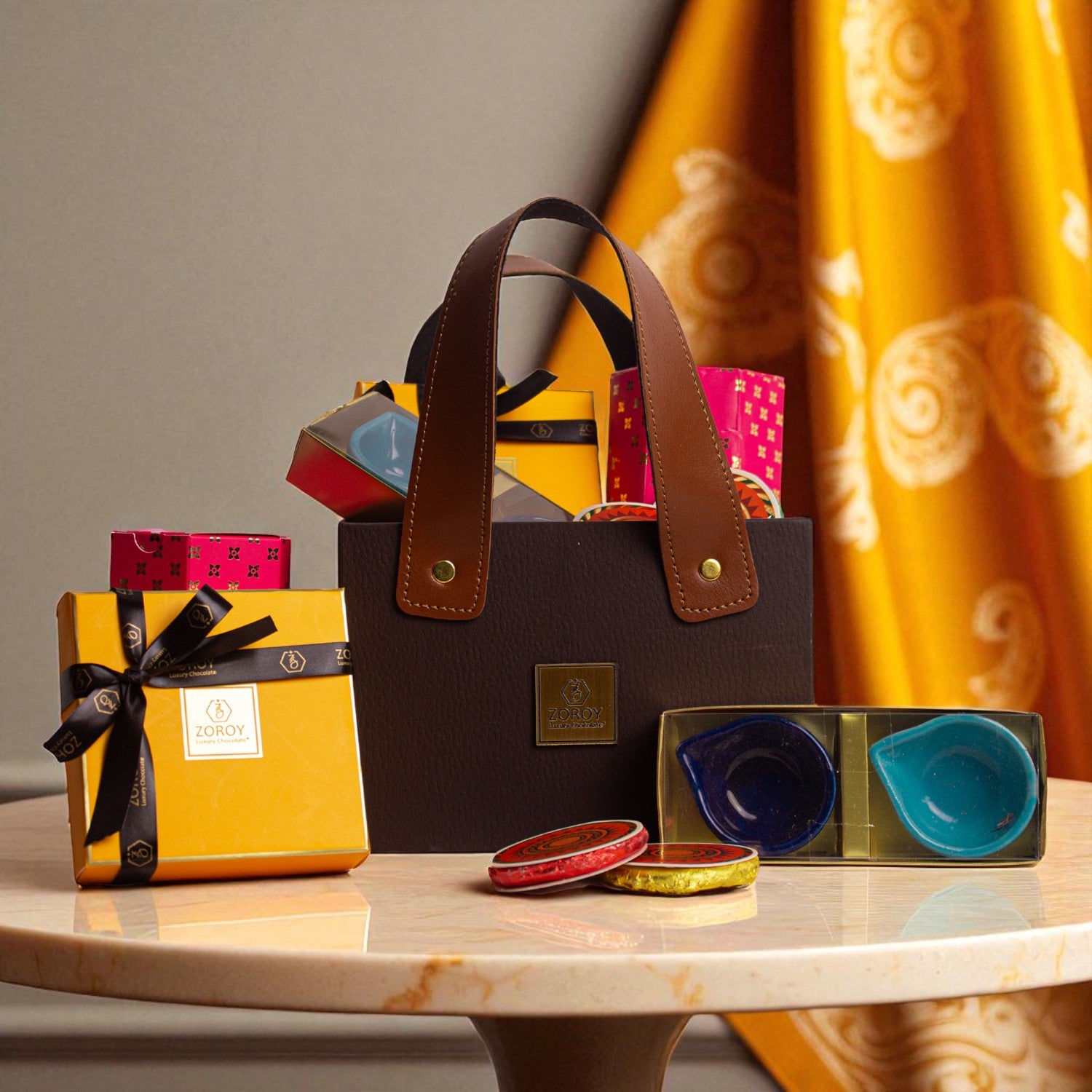 ZOROY Trio Essential Hamper – Festive Gift Basket with 2 Ceramic Diyas, 100g Almonds, Chocolates & Choco Biscuits
