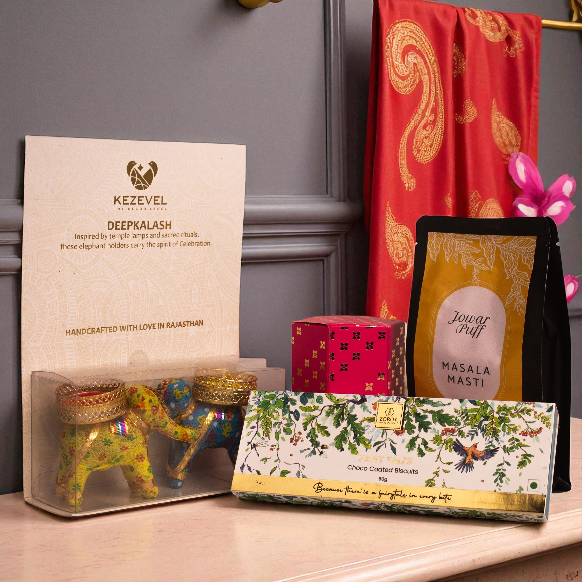 Birds of Paradise Hamper – Keepsake Bag Box with Dry Fruit, Chikki, Choco Biscuit & Ceramic Elephant Candle Holders| Diwali, Corporate & Bulk Festive Gifting