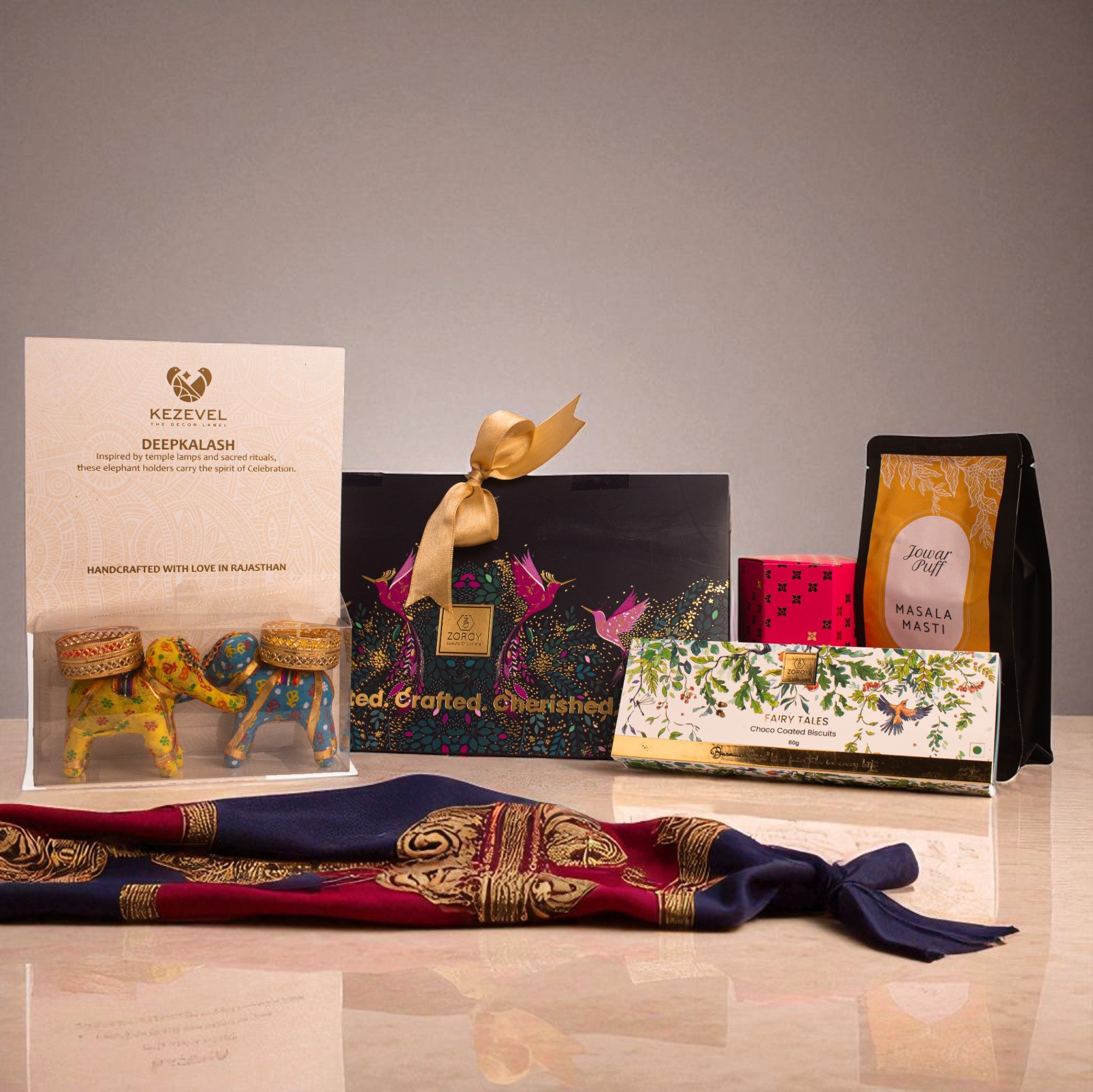 Birds of Paradise Hamper – Keepsake Bag Box with Dry Fruit, Chikki, Choco Biscuit & Ceramic Elephant Candle Holders| Diwali, Corporate & Bulk Festive Gifting